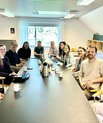 Group members gathered in meeting room